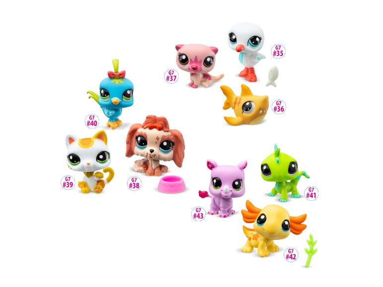 Een collectie kleurrijke Littlest Pet Shop figuren, waaronder een vogel, kat, hond en andere dieren.