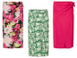 Drie wikkelrokken: een met bloemenprint, een met groene bladeren en een effen roze.