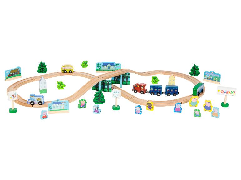 Ensemble de train en bois Peppa Pig avec des trains, des bus et des figurines.