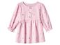Roze baby ribfluwelen jurk met lange mouwen en geborduurde hartjes.