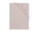 Opgevouwen lichtbeige hoeslaken met elastiek