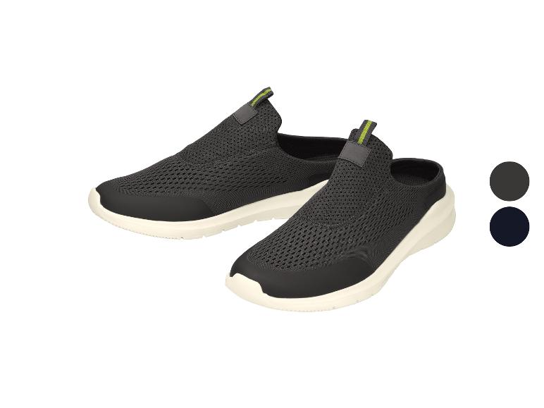 Grijze mesh sportschoenen met witte zool en groene details.