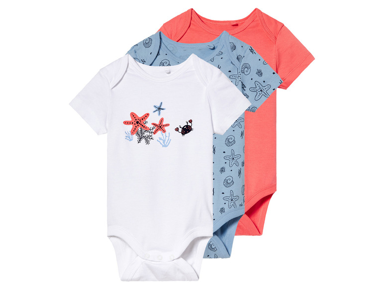 Drie baby-rompers met zeedierenmotief.