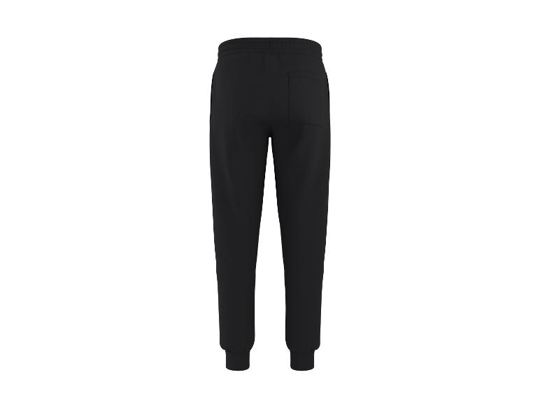 Pantalon de jogging noir avec taille élastique et chevilles resserrées, vue de dos.