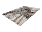 Tapis moderne à motif d'arbres, tons beige et gris.