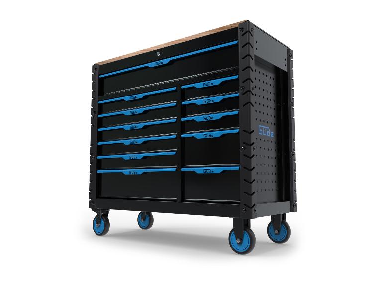 Chariot d'outils Güde noir métallique avec tiroirs bleus sur roulettes.
