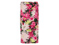 Een lange, roze rok met bloemenprint.
