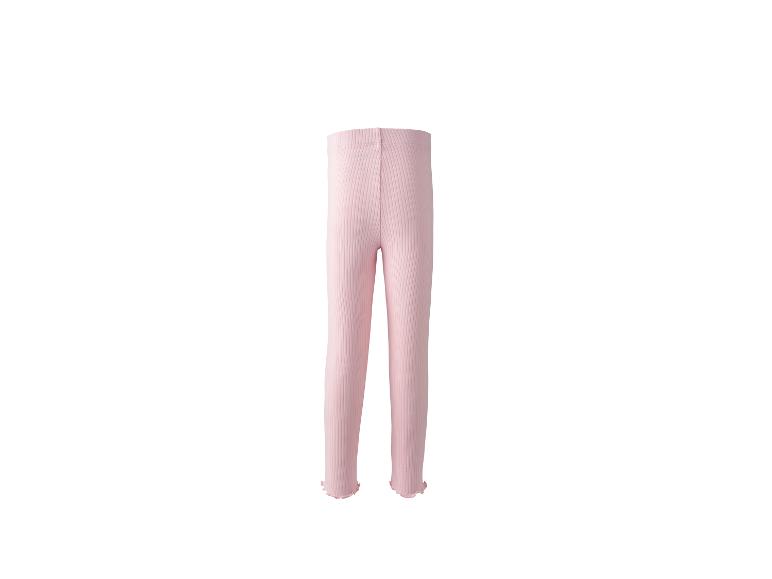 Legging bébé côtelé rose clair avec bords ondulés.
