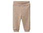 Pantalon bébé côtelé beige avec taille repliable.