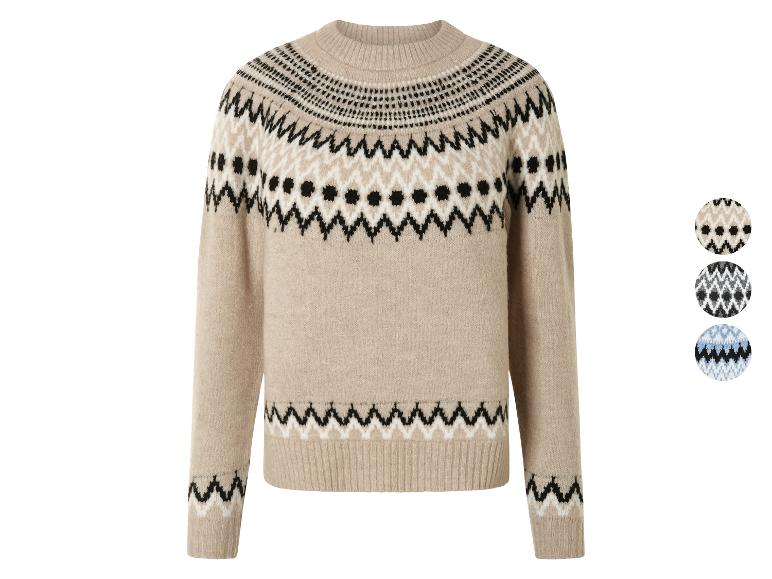 Pull beige en tricot avec un motif géométrique noir et blanc.