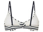 Een witte bikini top met zwarte strepen.