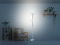 Un lampadaire argenté avec deux lumières dans un salon moderne.