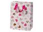 Sac cadeau blanc avec motif de cœurs roses et marron, avec poignée en ruban rose.