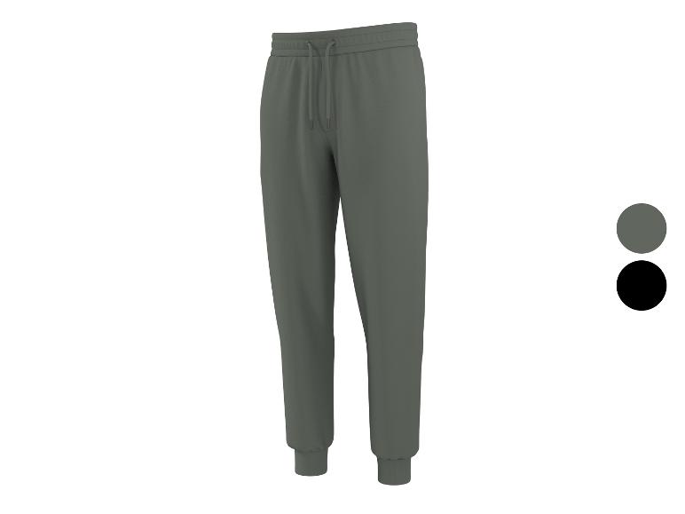 Pantalon de jogging gris avec cordon de serrage et chevilles resserrées, avec échantillons gris et noir.