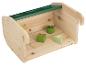 Houten opbergdoos met groene blokken met bladeren en een bloem.