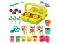 Kit de jardinage Play-Doh avec pâte à modeler, outils et moules pour créer des fleurs.