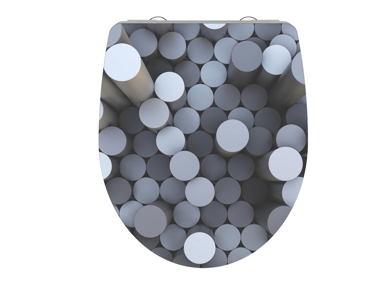 Een toiletbril met een abstract patroon van grijze cirkels.