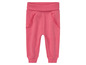 Pantalon de survêtement rose à volants pour filles.