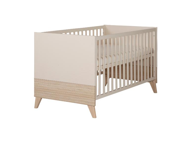 Lit bébé en bois au design moderne dans des couleurs claires.