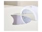 Lampe UV blanche pour ongles avec plaque inférieure amovible sur une surface claire.