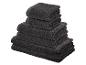 Pile de serviettes éponge gris foncé de différentes tailles.