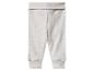 Pantalon bébé côtelé gris avec taille et chevilles à revers.