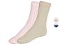 Twee paar zachte sokken, een in roze en een in beige.