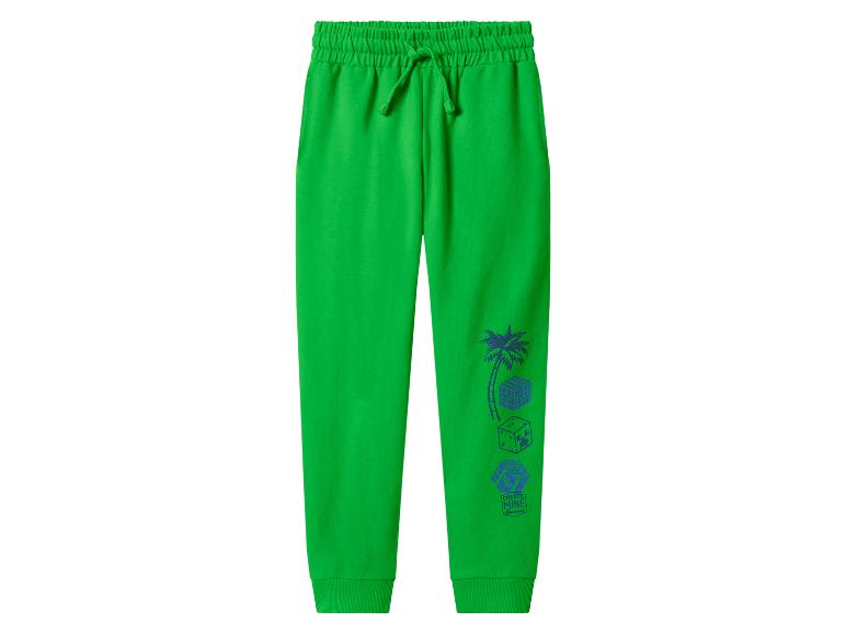 Groene joggingbroek met trekkoord en blauwe Minecraft-geïnspireerde print op de pijp.