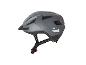 Casque de vélo CRIVIT gris avec visière et réflecteurs.