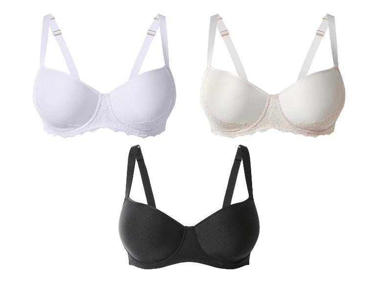 Drie beha's in wit, beige en zwart, met verstelbare bandjes en kanten details.