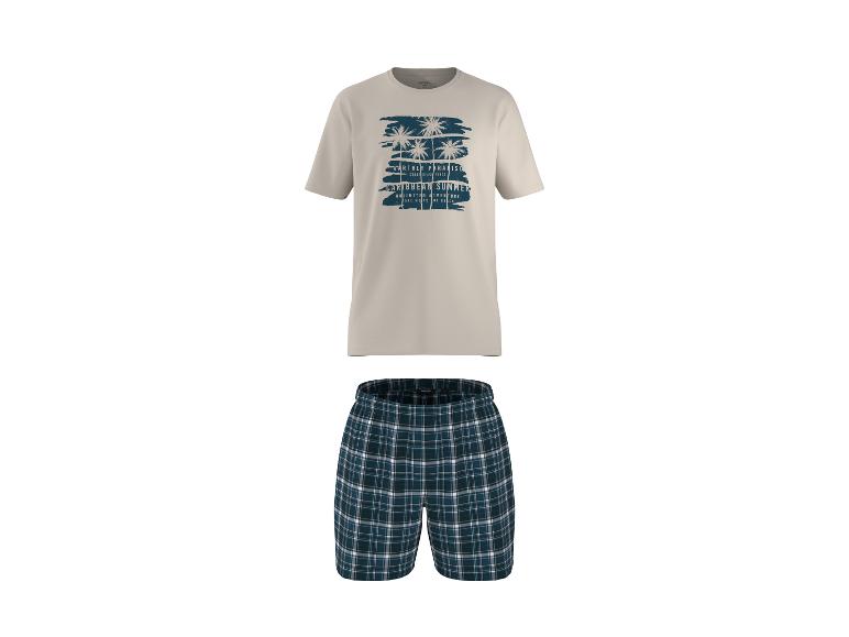 Pyjama homme : t-shirt beige à motif palmiers et short à carreaux.