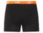 Shorts noirs Puma avec bande orange.