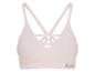 Soutien-gorge de sport rose clair avec bretelles croisées et logo texte.