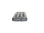Matelas gonflable gris avec surface rainurée et valve sur le côté.