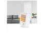 Un radiateur électrique blanc avec une grille qui émet de la chaleur.