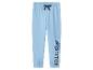 Pantalon de survêtement bleu pour enfant avec imprimé de personnage de dessin animé et texte 'STITCH' sur la jambe.