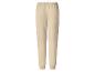 Pantalon de jogging beige avec taille élastique et chevilles côtelées.