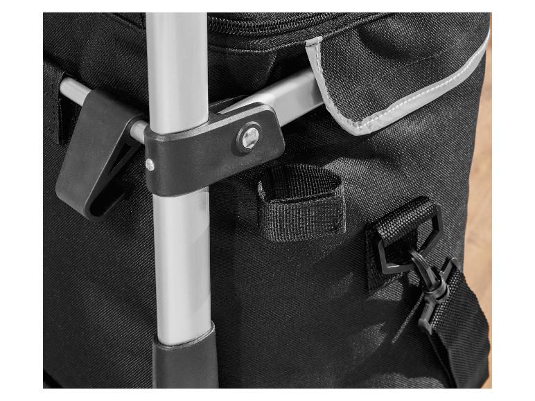 Détail d'un sac de courses pliable avec poignées et bandoulière.