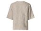 Vue arrière d'un haut beige à manches courtes en tissu texturé.