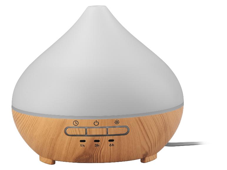 Diffuseur d'huiles essentielles en forme de goutte d'eau avec base imitation bois et boutons de commande.
