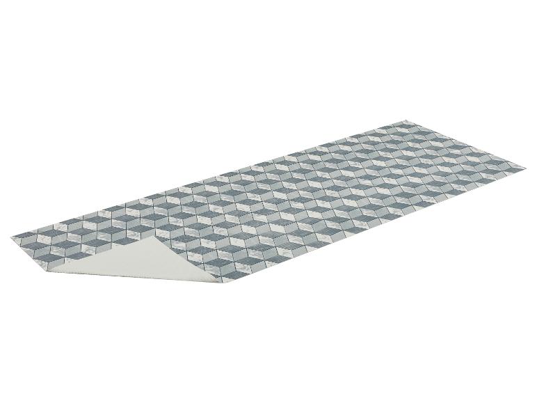 Loper met een geometrisch 3D-kubuspatroon in blauw- en wittinten