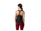 Femme en débardeur de sport noir CRIVIT et leggings bordeaux, vue arrière.