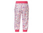 Pantalon pour enfant avec un motif de points roses et mauves.