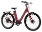 Een roze elektrische fiets met een riem aandrijving en Schwalbe banden.