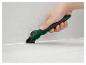 Een hand gebruikt een Parkside voegtool.