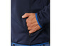 Une veste bleu marine avec une fermeture éclair et une bordure bleues.