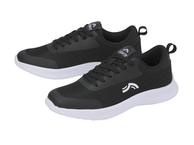 Twee paar zwarte en witte Crivit sneakers.