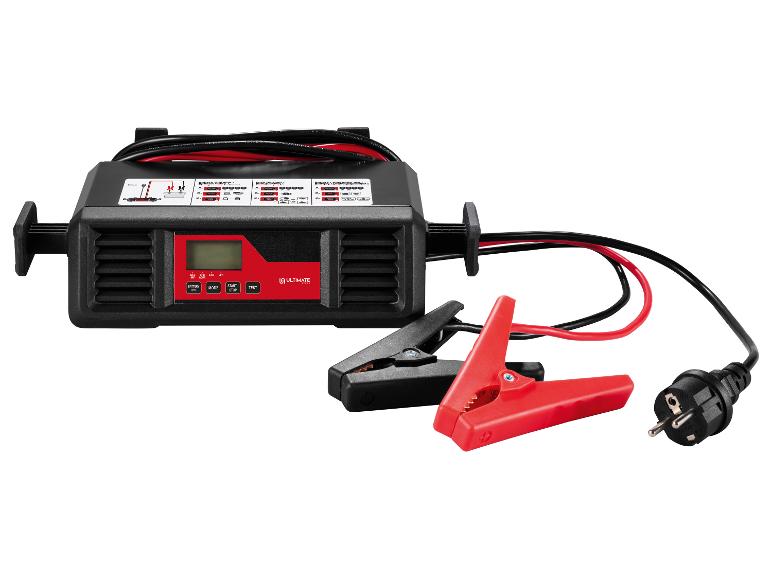 Un chargeur de batterie noir et rouge avec câbles et pinces.