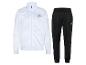 Survêtement blanc et noir avec veste zippée et pantalon de jogging.