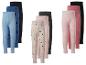 Lot de 9 leggings pour enfants en différentes couleurs et motifs, y compris des cœurs et des pois.